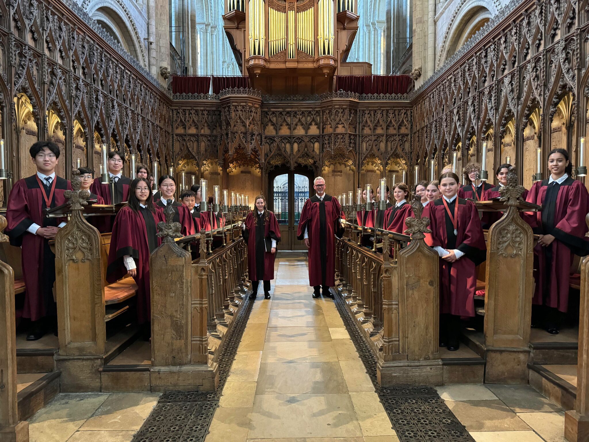 Met choristers in the choir stalls at Norwich cathedral.